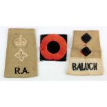 Indian cloth epaulettes - 1x RA, 1x Baluch, plus a cloth divisional badge. (3)
