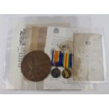 BWM & Victory medals with memorial plaque, scroll, letters one informing he was missing the other