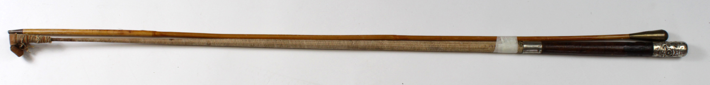 Swagger type sticks a Riding crop for the Royal Artillery and a second example. (2)