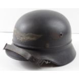 German WW2 beaded type helmet with good lufftscutz decal complete with lining and chin strap.