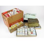 Crate containing large quantity of cards, in packets, boxes, tin, etc, several near complete sets