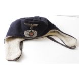 German cold weather cap, sheepskin lined, Officers ? badges to front, service worn but good