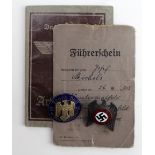 German Nazi Arbeitsbuch, and Fuhrerrchein, plus two enamelled badges. (4)