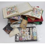 Large quantity of World stamps in a box, several albums / stockbooks, stock sheets, packets, etc.