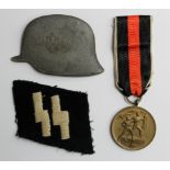 German Nazi 'Sudetenland' Medal, 'SS' cloth patch, plus large pin badge of a German Helmet. (3)