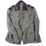 German Uniform WW2 an SS mans tunic service wear, seems moth free, iron cross ribbon and award loop,