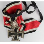German Nazi Knights Cross with Oak Leafs and Swords. Both stamped '800'.