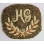 Cloth Badge: "HG" in wreath embroidered WW1 arm badge for Hotchkiss Gunner (Edwards & Langley 58A)