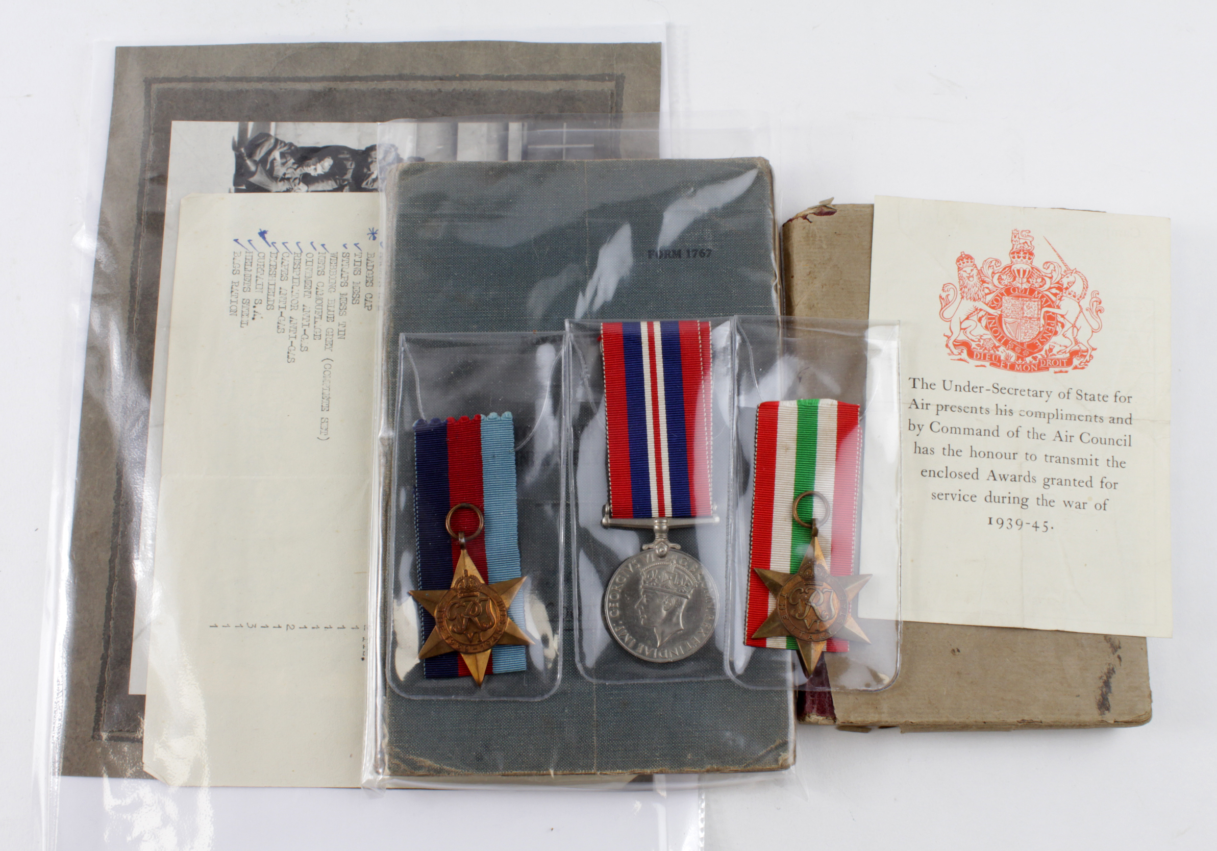 RAF W/OP log book with 1939-45 star, Italy star, war medal and a superb note book full of