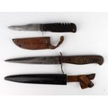 WW1 German trench knife with scabbard and leather frog, with one other. (2)