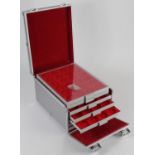 Lindner Trays (8) for crown-size coins, housed in an aluminium carrying case, all good condition,