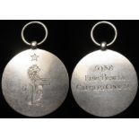 Masonic (poss.) unmarked silver medal shows standing lion under a star. Back reads "1938 Eric