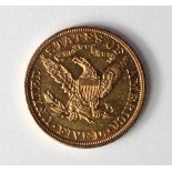 USA gold $5 1880 GVF with a few light contact marks under magnification
