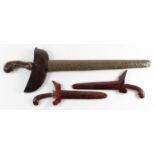 Kris dagger with wooden handle and metal scabbard, plus two miniature versions. (3) Sold a/f