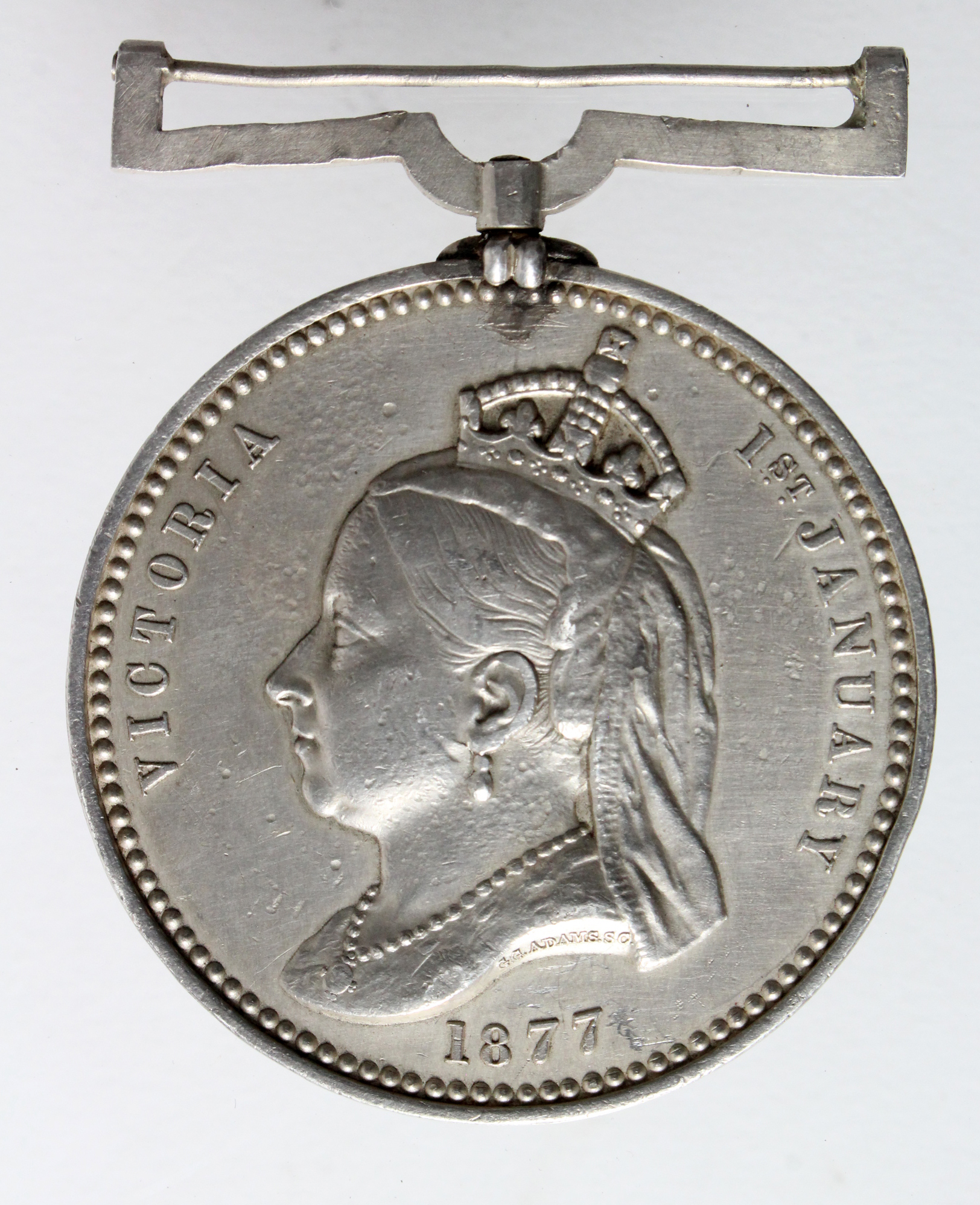 Empress of India Medal 1877 in silver. Edge bump and contact marks. GF
