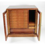Large glazed 30-tray (plus other compartments) mahogany coin cabinet by Nichols, with key, housing a