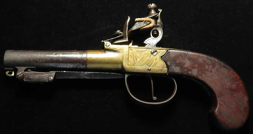 Flintlock Pistol, turn off barrel, brass framed pocket pistol circa 1810. Round barrel 3" with