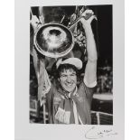 Footballer Emlyn Hughes signed 17x20" silver gelatin photo, holding the European Cup 1978 when