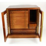 Large glazed 30-tray (plus other compartments) mahogany coin cabinet, probably by Nichols, with key,