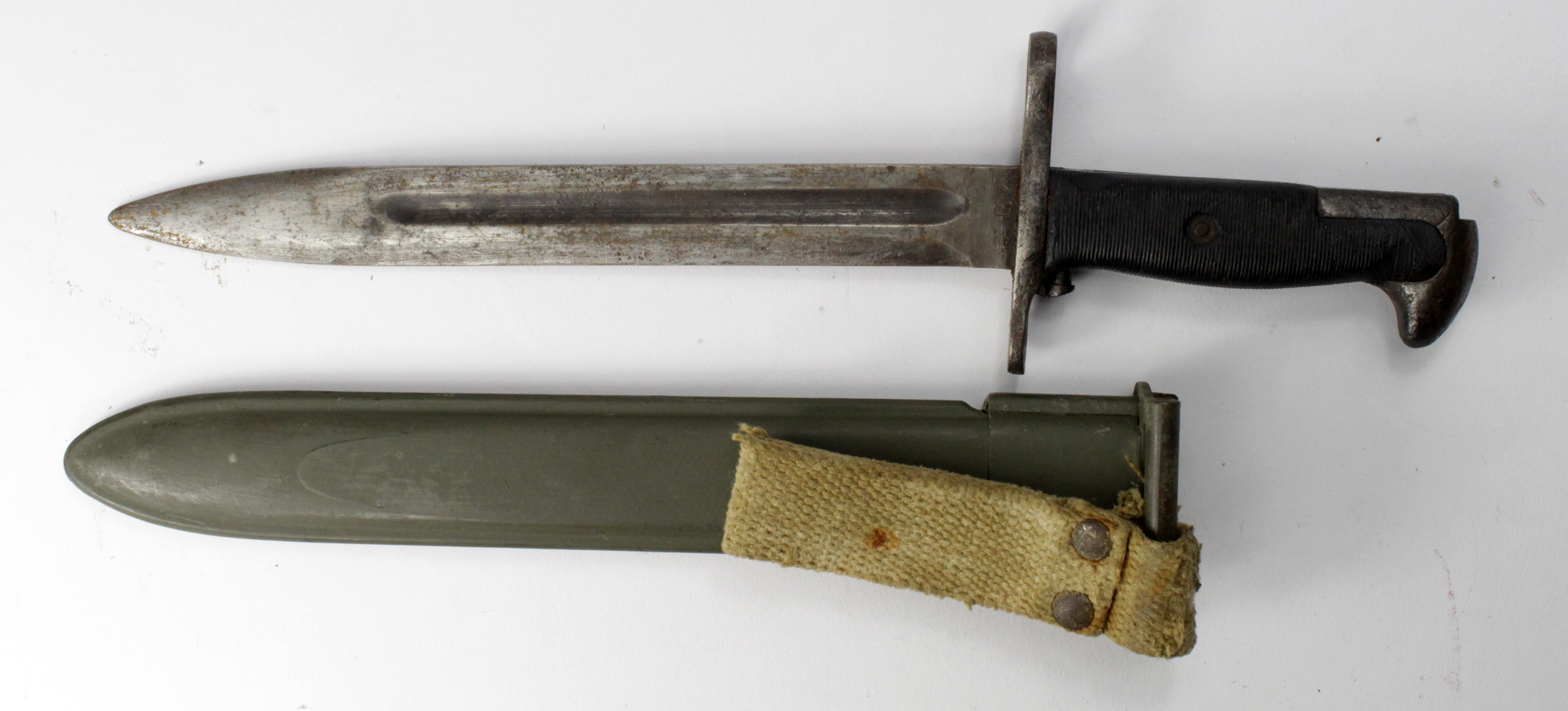 Bayonet: U.S. M1 Rifle Bayonet in its plastic scabbard with khaki frog (a/f). Service worn overall.