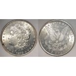 USA Morgan Silver Dollar 1878-CC, UNC with some tone spots, in an ersatz slab (MS67).