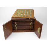 World Coins, collection 19thC to modern, housed in a 14-tray mahogany coin cabinet with key (lock