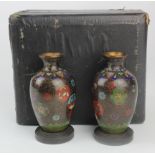 Pair of small cloisonne vases (possibly Chinese), height 90mm, each on a stand, contained in