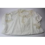 Queen Victoria interest. A cotton nightgown with lace trim previously belonging to HM Queen