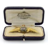 18ct gold "RFC" brooch in the form of wings set with tiny diamonds and coloured enamel decoration.