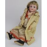 Bisque headed doll, circa 19th Century, with weighted blue glass eyes, open mouth showing teeth,