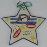 Clarice Cliff star shaped plaque / decoration, depicting the Libra zodiac sign, signed to reverse '