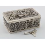 Silver hallmarked singing bird automaton music box, with elaborate embossed cupid decoration,