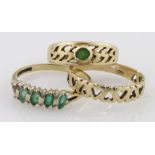 Three 9ct yellow gold rings, one heart band and two emerald set (with a stone missing) weight 5.5g