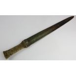 Unidentified Middle Eastern dagger with decorative brass handle, engraved to blade, no scabard,