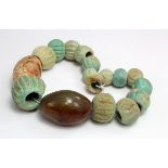 A selection of blue Roman melon beads and two hard stone beads. C, 4th century AD. Ex Lockdales