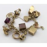 9ct Charm bracelet with a good assortment of charms attached. total weight 48.2g