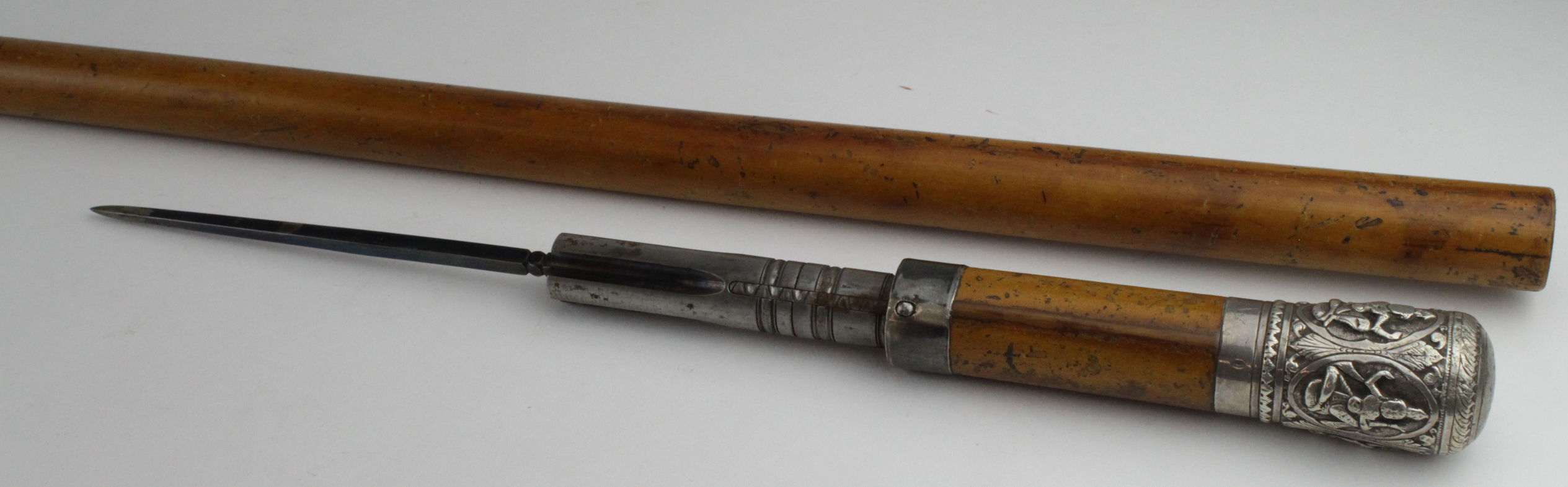 Walking Cane. An unusual gadget walking cane, with Edwardian pepperbox 4 shot & detachable dagger,