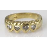 14ct yellow gold ring set with four hear shaped diamonds, finger size O, weight 7.3g