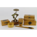 Mauchline ware. A collection of seven pieces of mauchline ware, including postal scales, letter