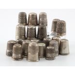 Twenty silver thimbles (two stamped 'Sterling Silver', one unmarked), includes a Charles Horner
