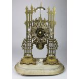 Skeleton clock. A large brass skeleton clock, silvered dial with Roman numerals, mounted on a marble