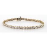 9ct gold tennis bracelet set with thirty-nine small diamonds, total weight 6.7g