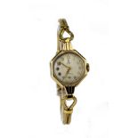 Ladies Tudor Royal (Rolex) 9ct cased wristwatch, hallmarked Chester 1950 on a yellow metal bracelet.