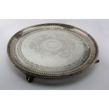 Silver salver with engraved decoration, raised on four feet, hallmarked 'Martin Hall & Co.,