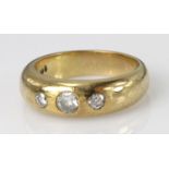 9ct yellow gold band ring set with three graduated diamonds, finger size O, weight 7.4g