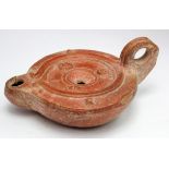 North African Roman slipware Oil Lamp. C, 2nd century AD. Reddy brown colour decorated with actors
