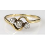 18ct yellow gold diamond three stone crossover ring, finger size O, weight 2.3g