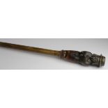 Walking Stick. A 19th century walking stick with large carved knop, depicting a figure wearing a hat