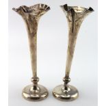 Two silver flower tubes hallmarked Birm. 1904 one is slightly bent (both have loaded bases)