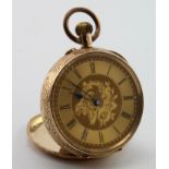 Ladies 14ct cased fob watch, the gilt dial with black roman numerals and foliage decoration.